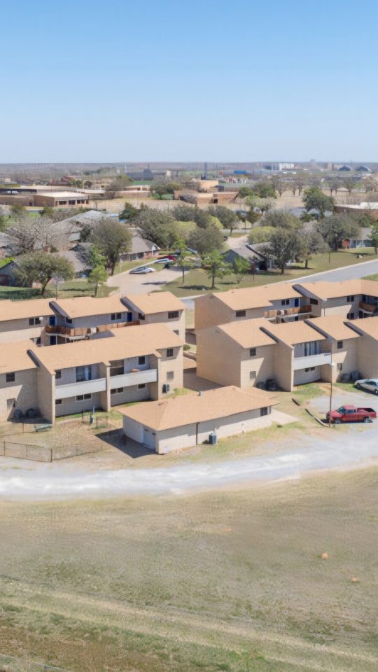 an aerial view of a large ranch with a large parking lot at The  Courtyard